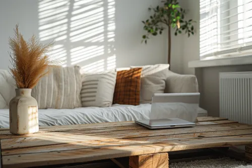 Ambiance chaleureuse d’un salon et d’une chambre meublés en bois de récupération, mettant en valeur un style durable et authentique